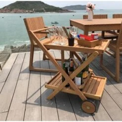 Desserte De Jardin A Roulettes En Bois D'eucalyptus FSC - 69 X 51 X 75 Cm - Avec Porte-bouteilles - RAUHA -Mobilier De Jardin desserte de jardin a roulettes en bois d eucalyptus fsc 69 x 51 x 75 cm avec porte bouteilles rauha 3612408255912 597632